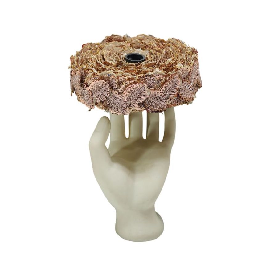 Decorative item resembling a hand holding a woven basket on a white background